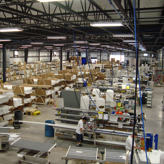 Inside of a Sunburst Factory with staff working.