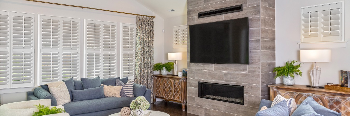 Interior shutters in Hayward living room with fireplace