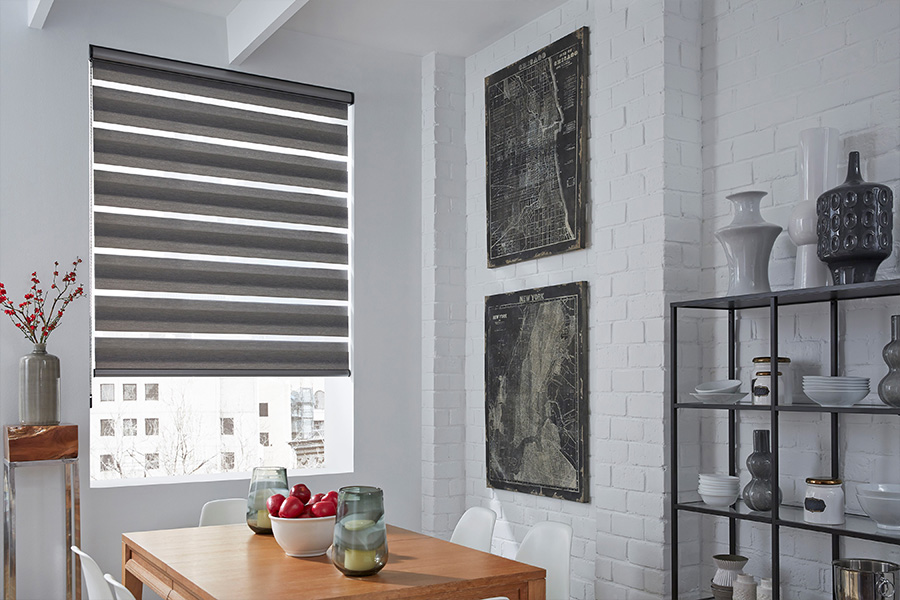 Horizontal striped gray shades on a tall window within a breakfast nook area.