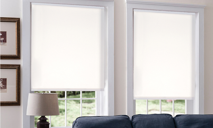 White roller shades in a living room