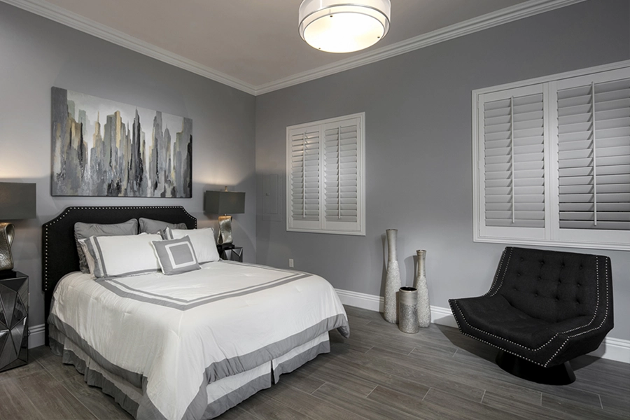 Close your custom Polywood shutters to beat the heat and keep your San Jose bedroom cool. White Polywood shutters on bedroom windows