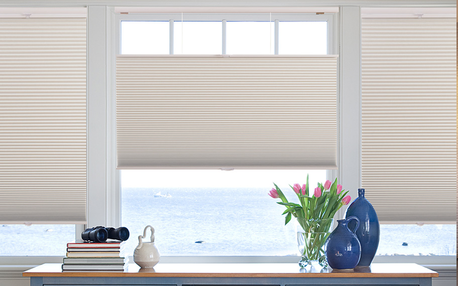 Energy efficiency with a modern twist in San Jose. Cellular shades in oceanside beach house.
